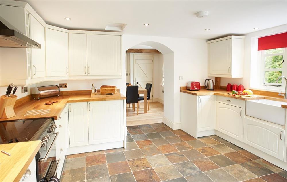 Large fully equipped kitchen with french doors opening to the patio at 2 The Oaks, Hoarwithy