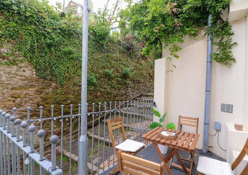 Enjoy a glass of wine on the patio at 2 The Old School House, Dartmouth