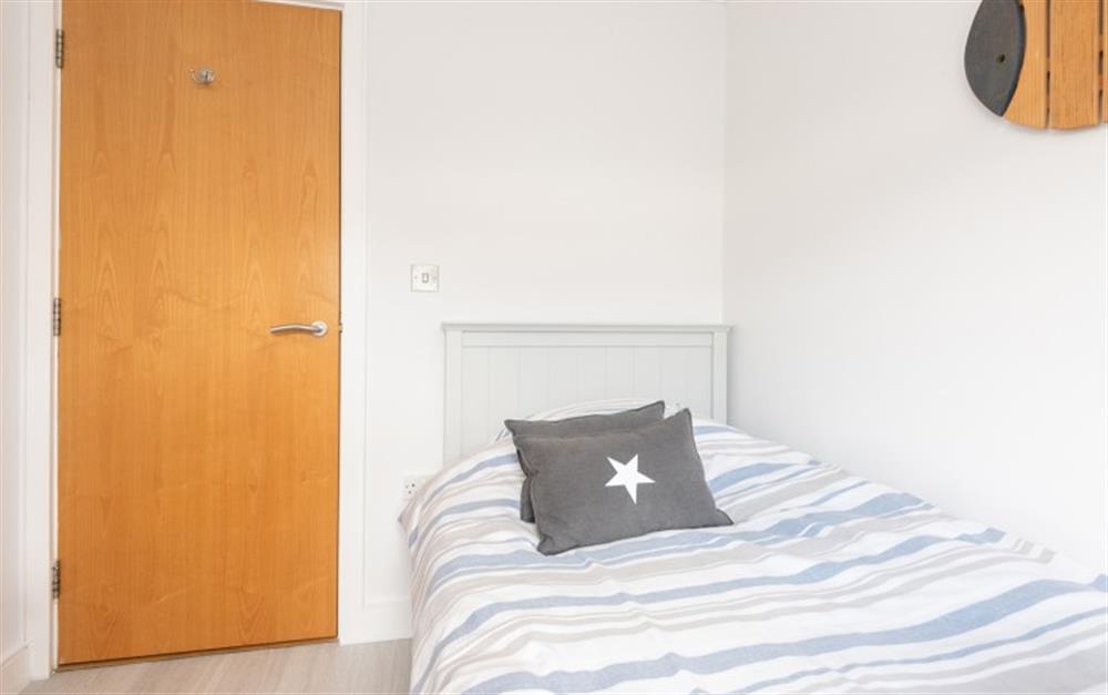 One of the bedrooms at 2 Thurlestone Beach Apartments in Thurlestone