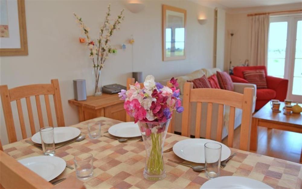 The dining area in the living room at 2 Thurlestone Beach Apartments in Thurlestone