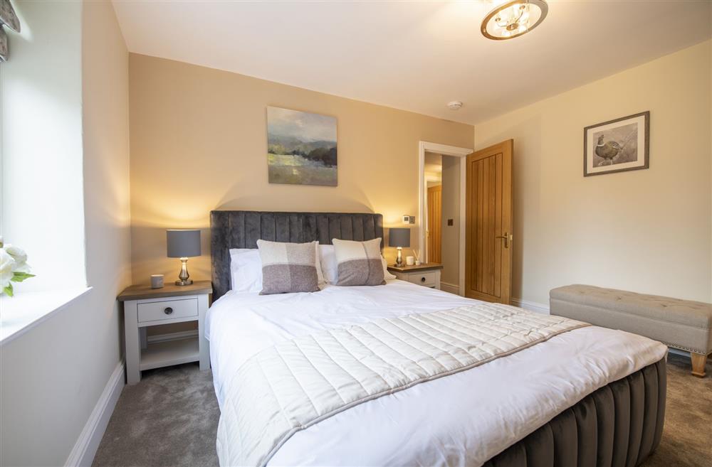 Bedroom two with 5’ king-size bed and views of the bustling village at 2 West End,  Northallerton
