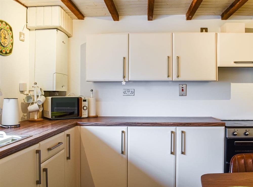 Kitchen at 2 White Horses Cottages in Pwllheli, Gwynedd