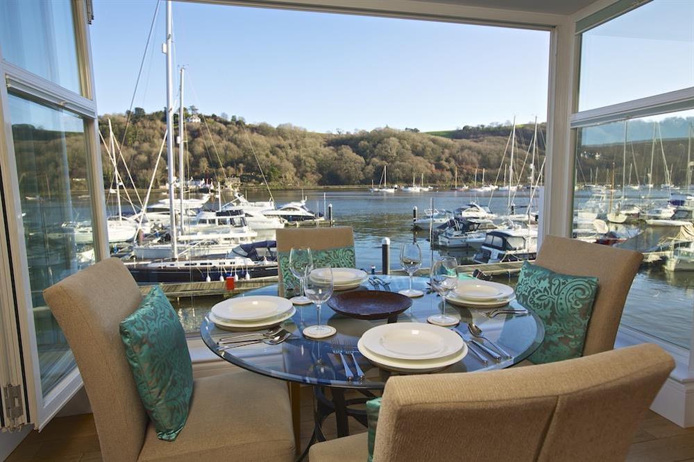 The dining area with lovely river views seats four comfortably (photo 2) at 20 Dart Marina in , Dart Marina