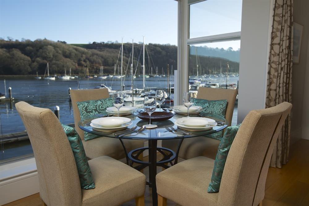 The dining area with lovely river views seats four comfortably at 20 Dart Marina in , Dart Marina