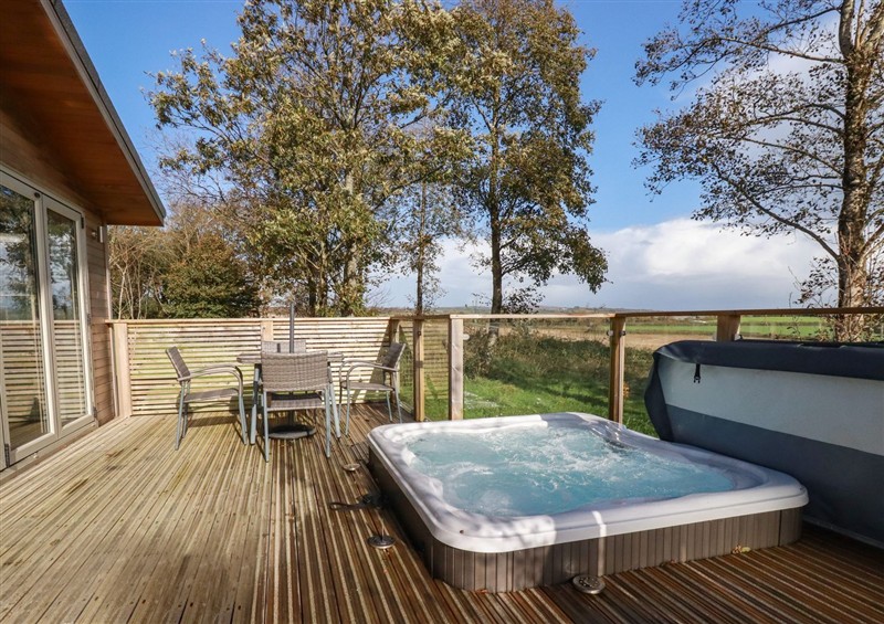 Spend some time in the hot tub at 20 Meadow Retreat, Dobwalls