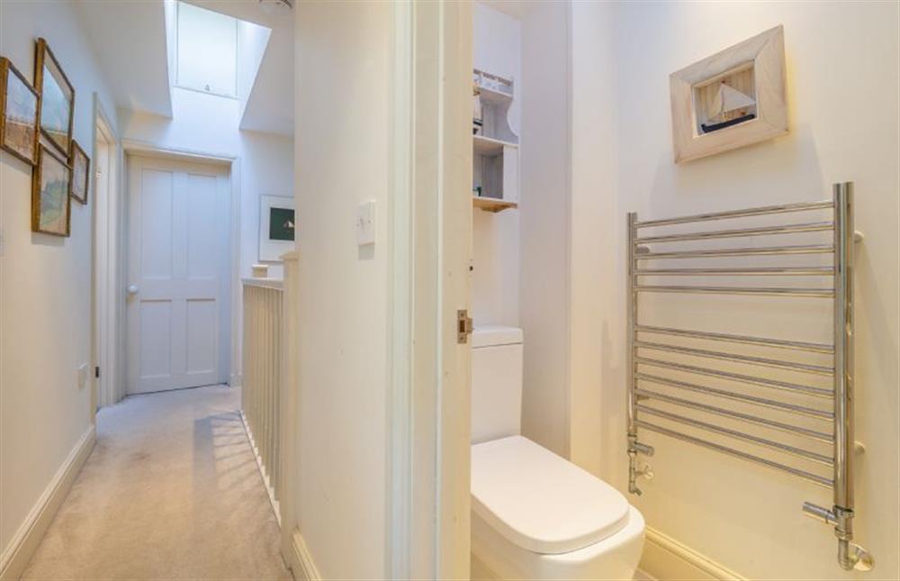 Landing and cloakroom with wash basin and WC