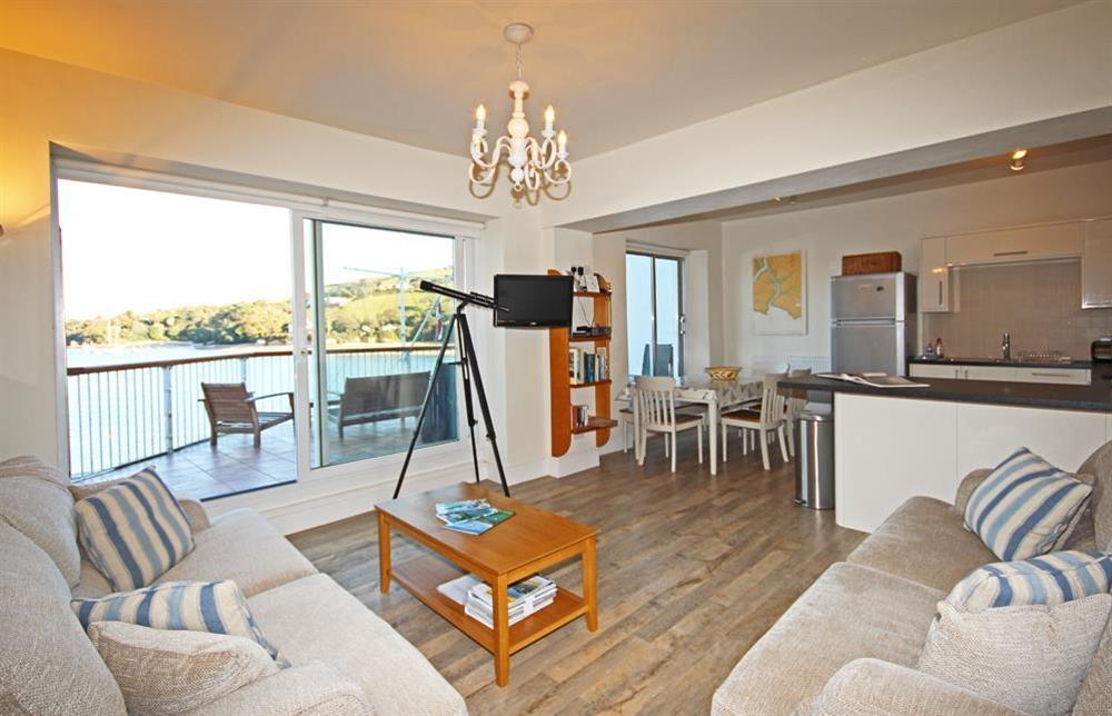 Open plan living area with doors to balcony at 22 The Salcombe in , Salcombe