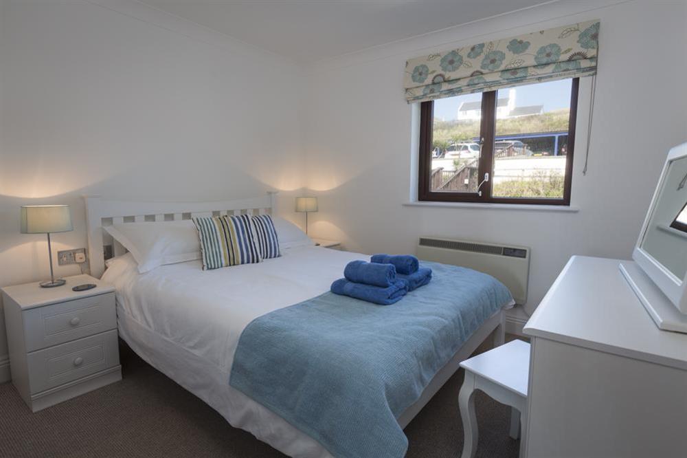 En suite master bedroom with King-size bed at 25 Burgh Island Causeway in , Bigbury-on-Sea