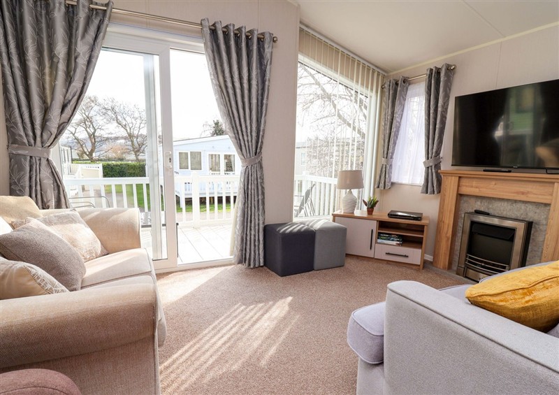Relax in the living area at 27 Conway Court, Prestatyn