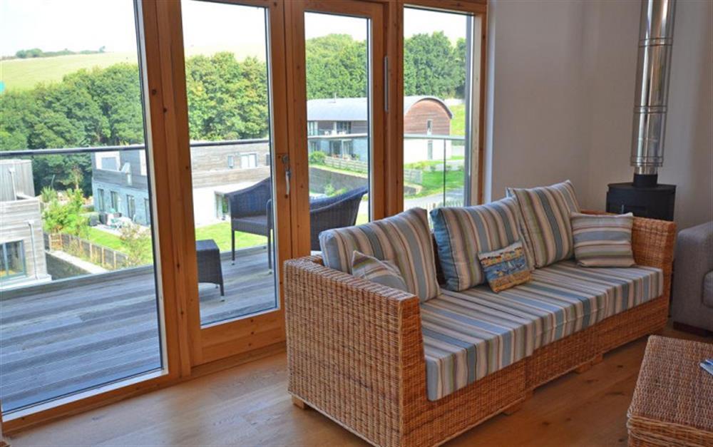Living room with balcony at 28 Talland Bay in Looe