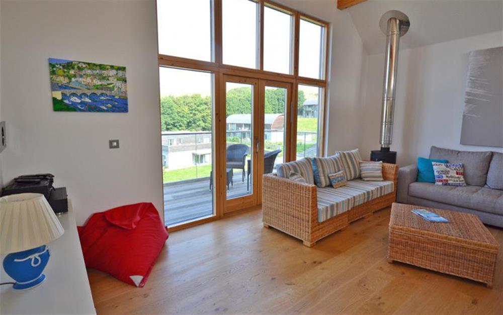 Living room with log burner at 28 Talland Bay in Looe