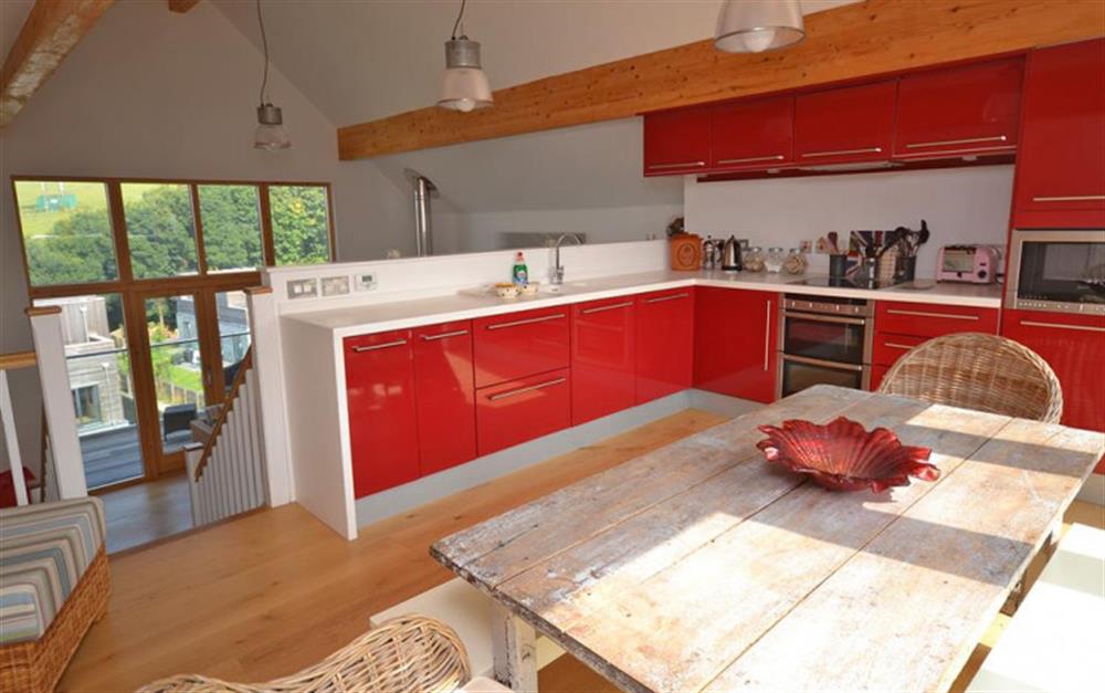 Open plan bright Kitchen and dining area at 28 Talland Bay in Looe