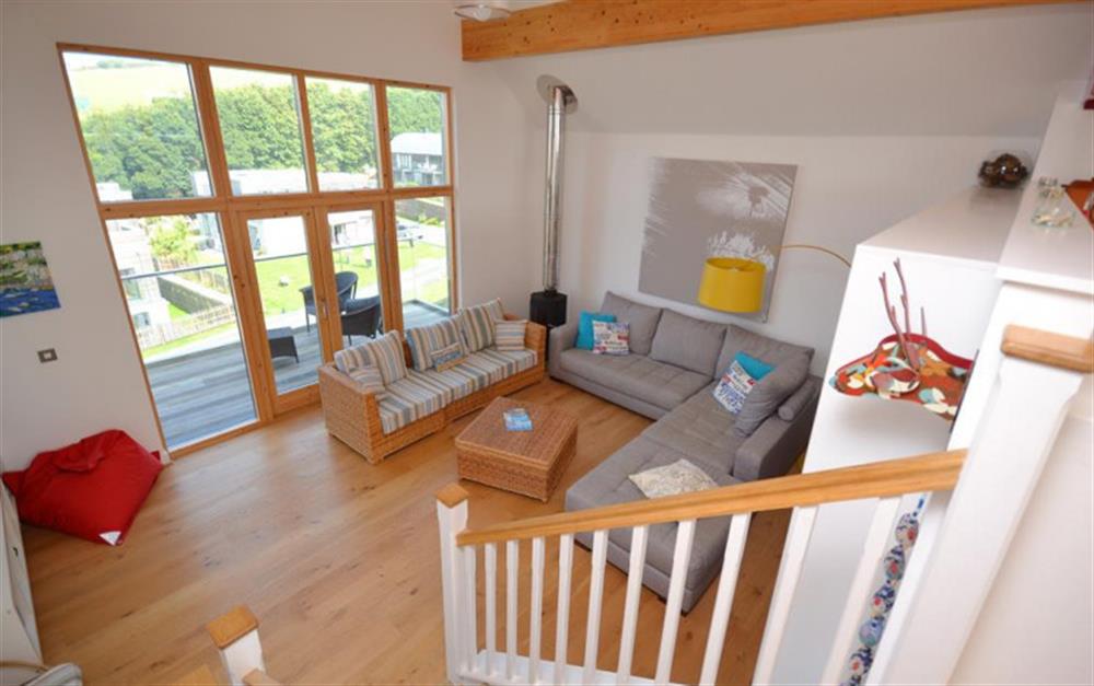 Stairs from kitchen down to vaulted ceiling living room at 28 Talland Bay in Looe