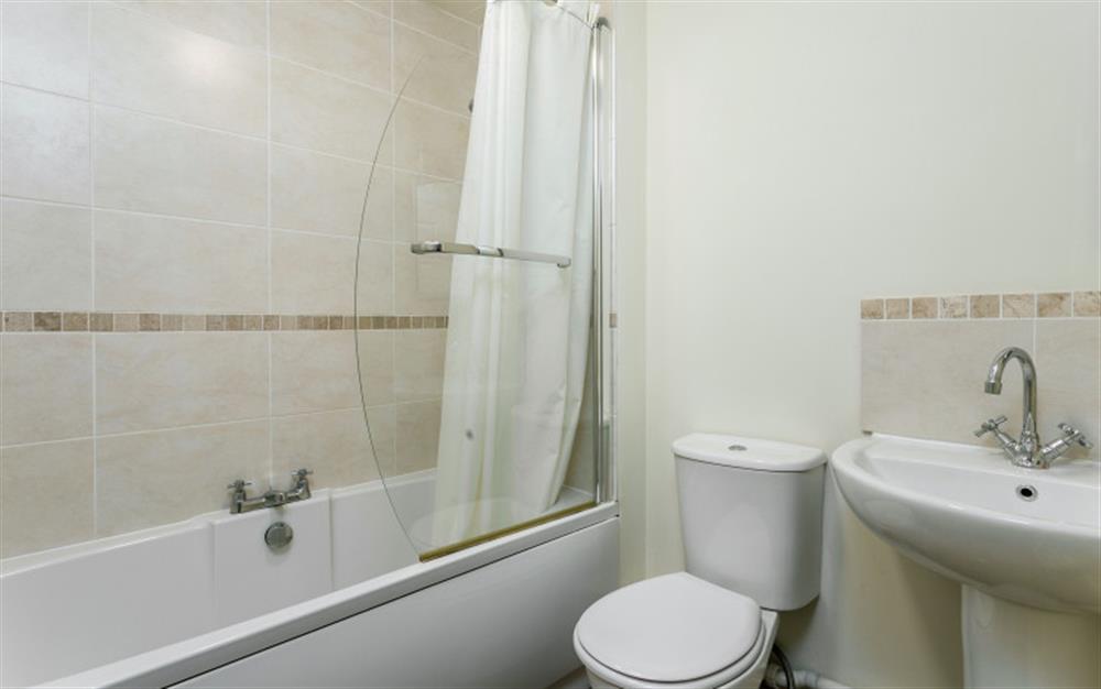 Bathroom with shower over bath at 3 Allington Square in Bridport