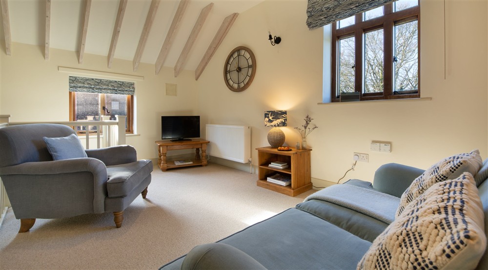 The bedroom and sitting room (photo 2) at 3 Cart Lodge Barn in Upper Sheringham, Norfolk