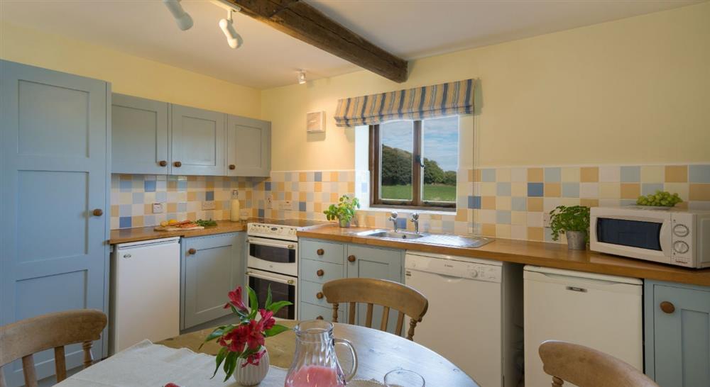 The country kitchen and dining room at 3 Cart Lodge Barn in Upper Sheringham, Norfolk