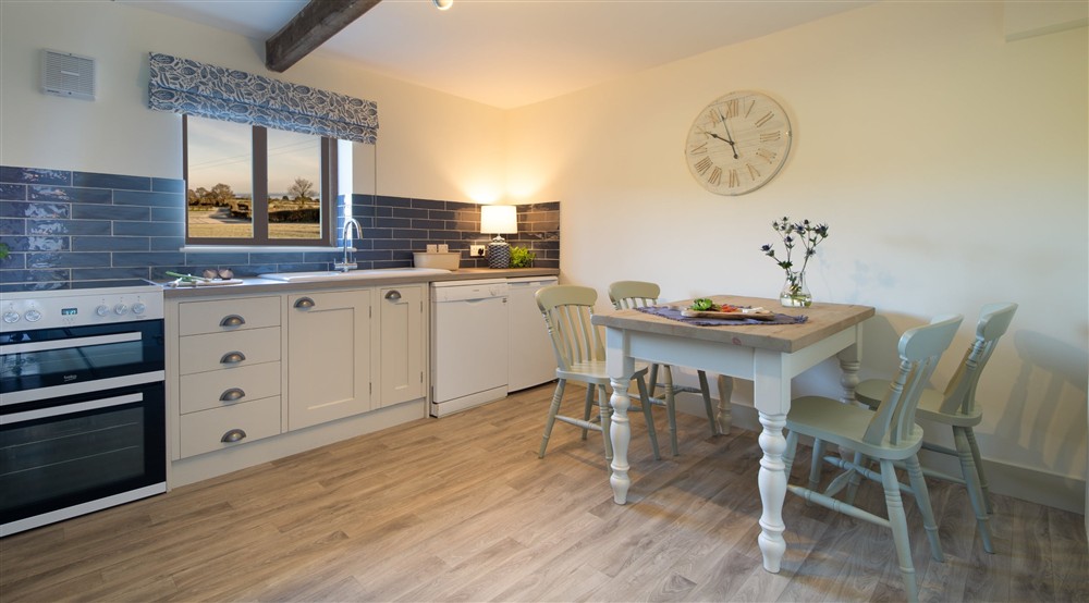 The kitchen and dining room at 3 Cart Lodge Barn in Upper Sheringham, Norfolk