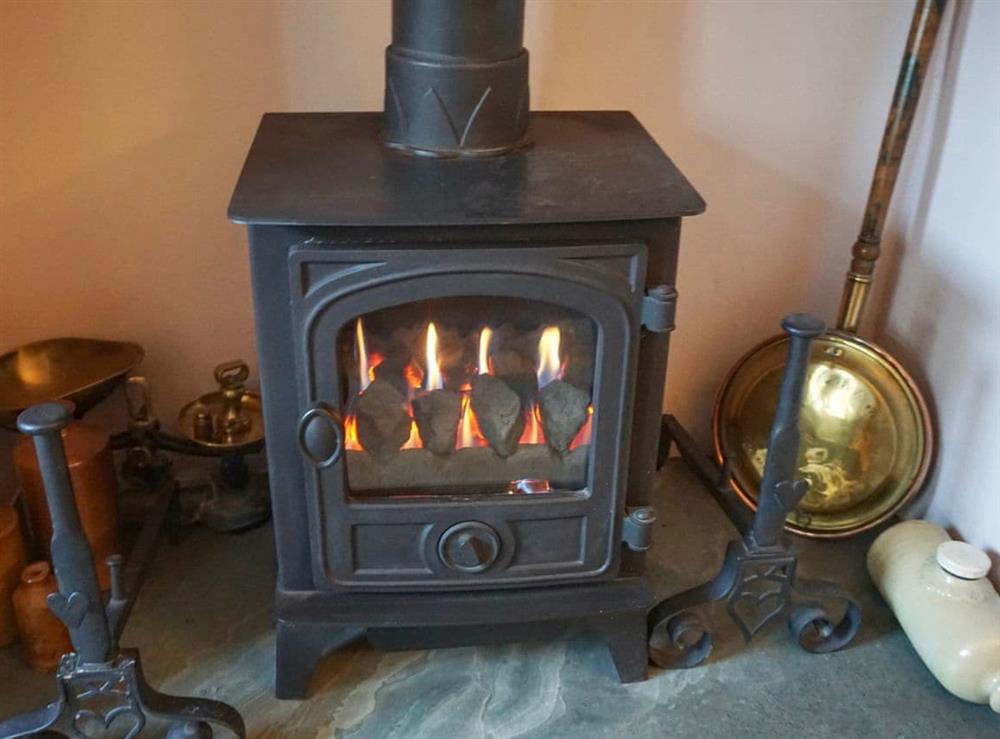 Gas stove in the living room at 3 Catherine Cottages in Keswick, Cumbria