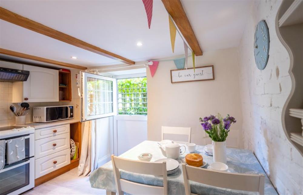 Ground floor: Kitchen with dining area and barn door at 3 Chapel Cottages, Docking near Kings Lynn