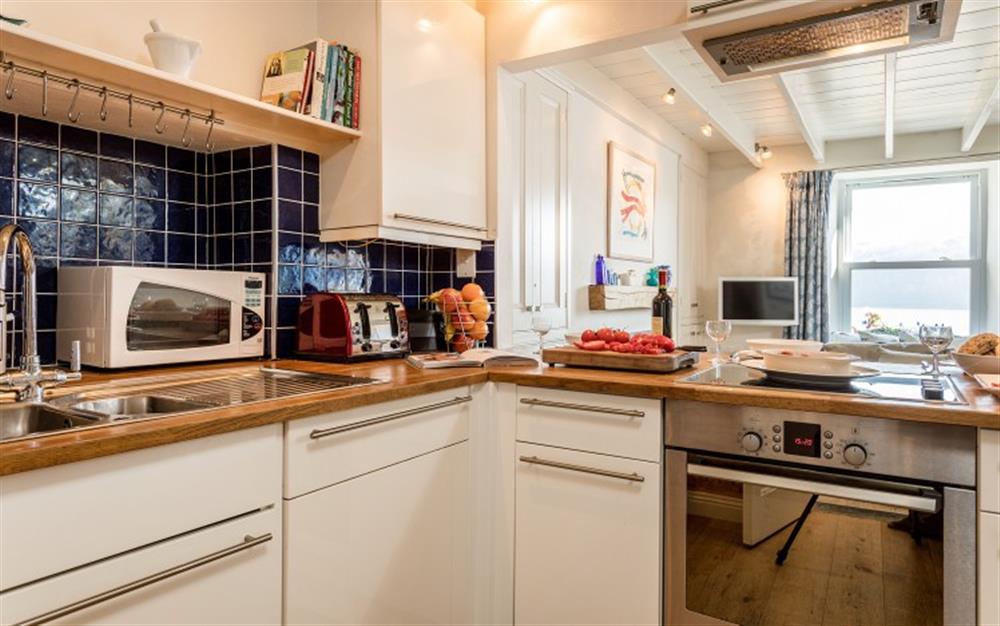 The downstairs being open planned means that chef isn't excluded from the rest of the family. at 3 Coastguard Cottage, River View in Helford Passage
