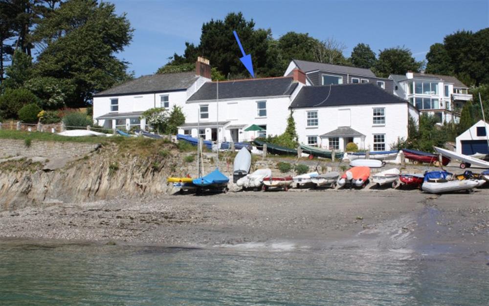 View of the cottage from the water at 3 Coastguard Cottage, River View in Helford Passage