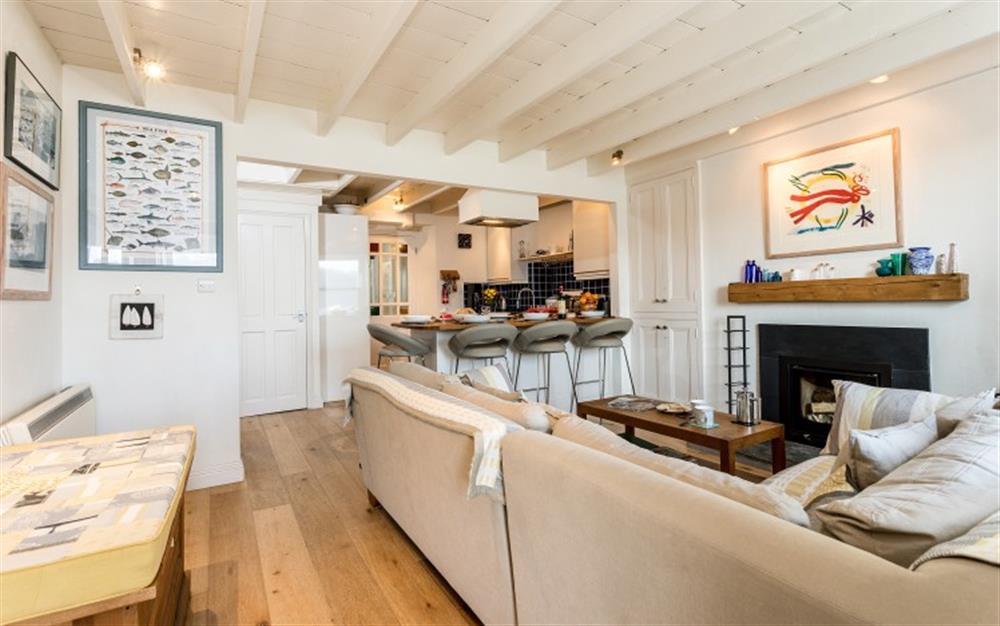 View of the lounge with the kitchen at the far end. at 3 Coastguard Cottage, River View in Helford Passage