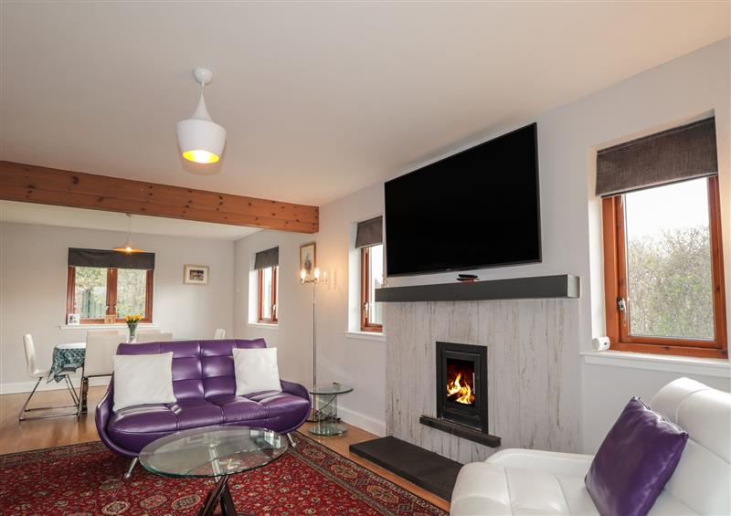 Relax in the living area at 3 Croftside, Aviemore