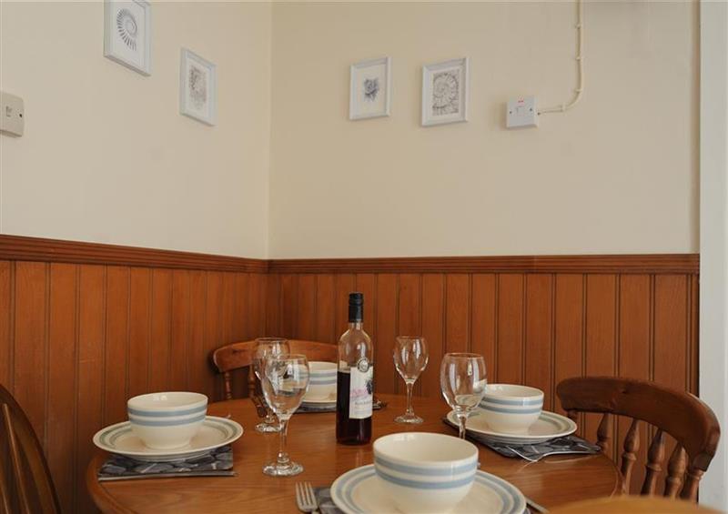 The dining area at 3 Dolphin Cottages, Lyme Regis