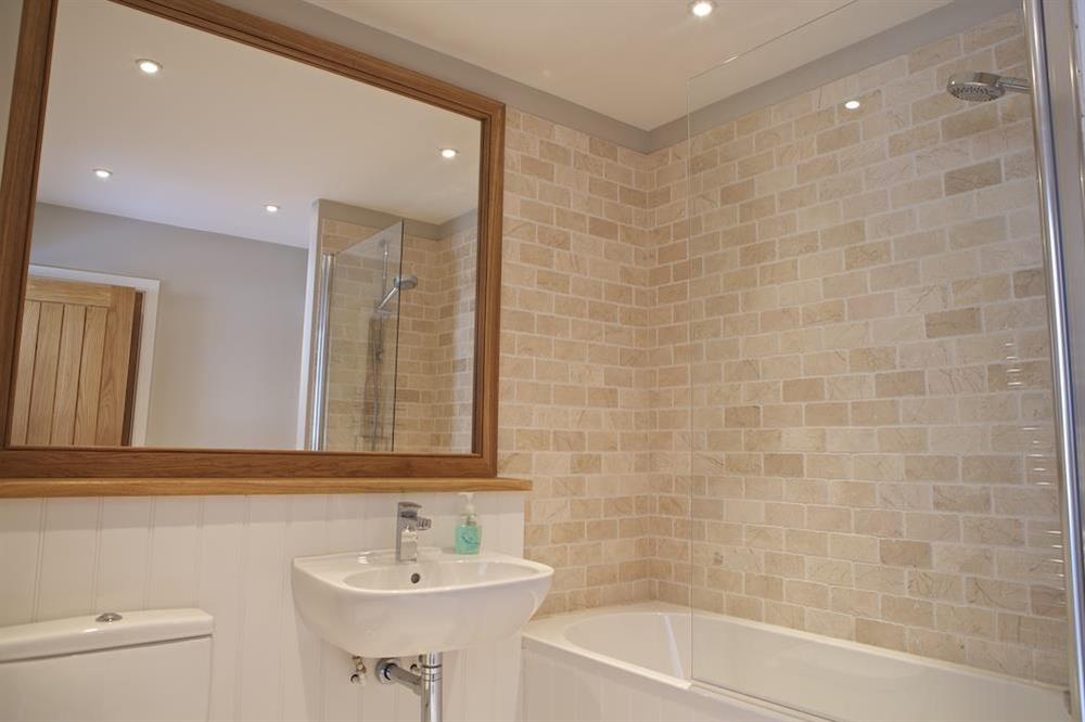 Fully tiled family bathroom (1st floor) at 3 Eddystone Row in , Salcombe
