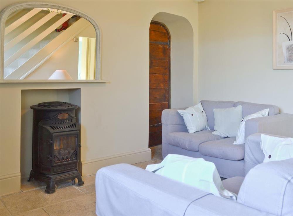 Cosy lounge provides access to stairway at 3 Gill Edge Cottages in Bainbridge, near Hawes, North Yorkshire