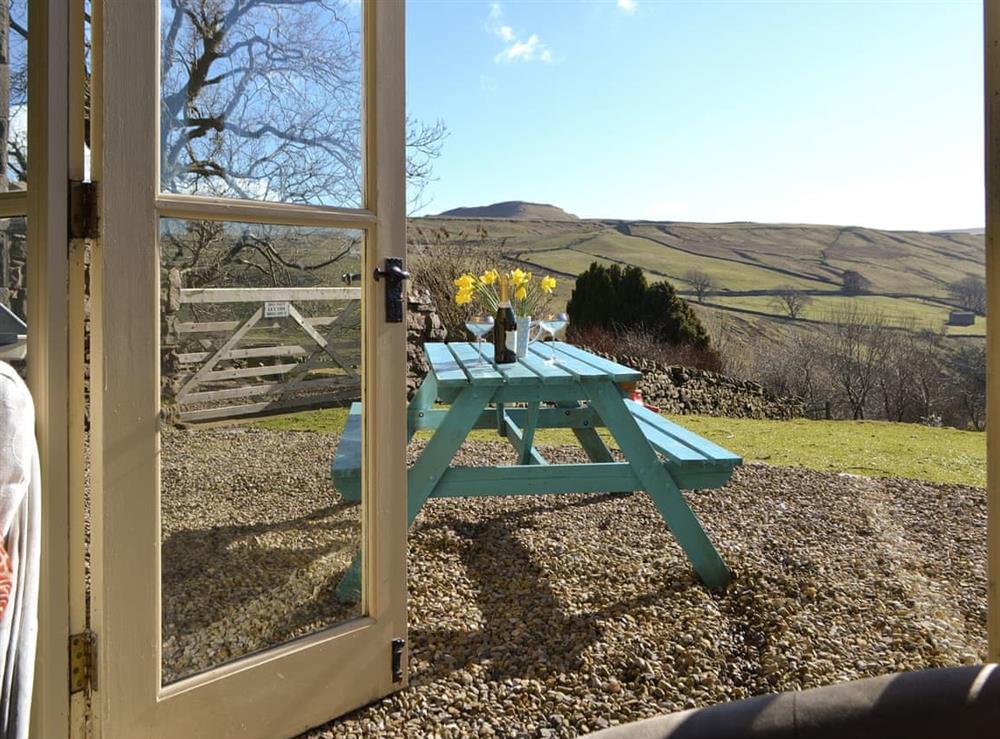 French doors from dining room command spectacular rural views at 3 Gill Edge Cottages in Bainbridge, near Hawes, North Yorkshire