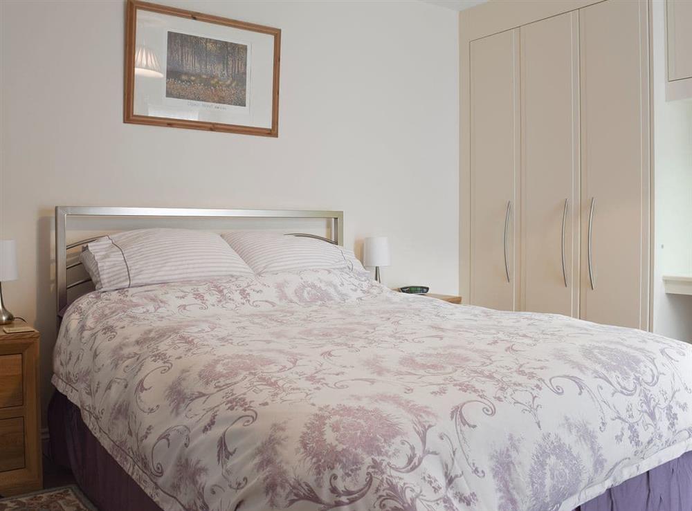 Double bedroom with ample storage at 3 Greta Grove House in Keswick, Cumbria