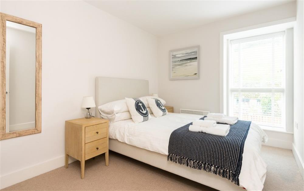 Bedroom 2 with 4ft6 double bed and bedside tables at 3 Island Place (Saltstone) in Salcombe