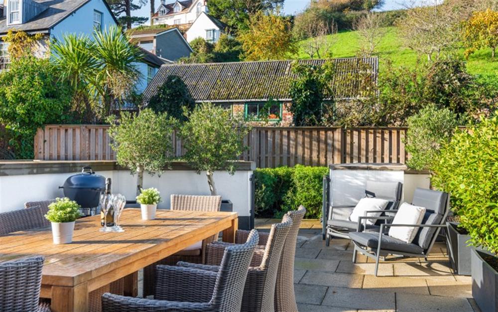The rear terrace with a generous dining space for 6 and barbecue at 3 Island Place (Saltstone) in Salcombe