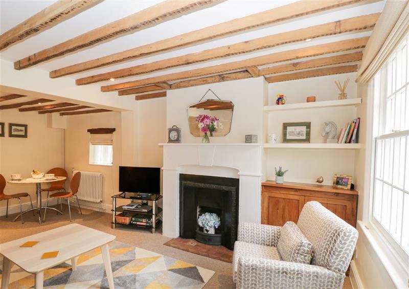 Relax in the living area at 3 Lake Cottages, Prestbury