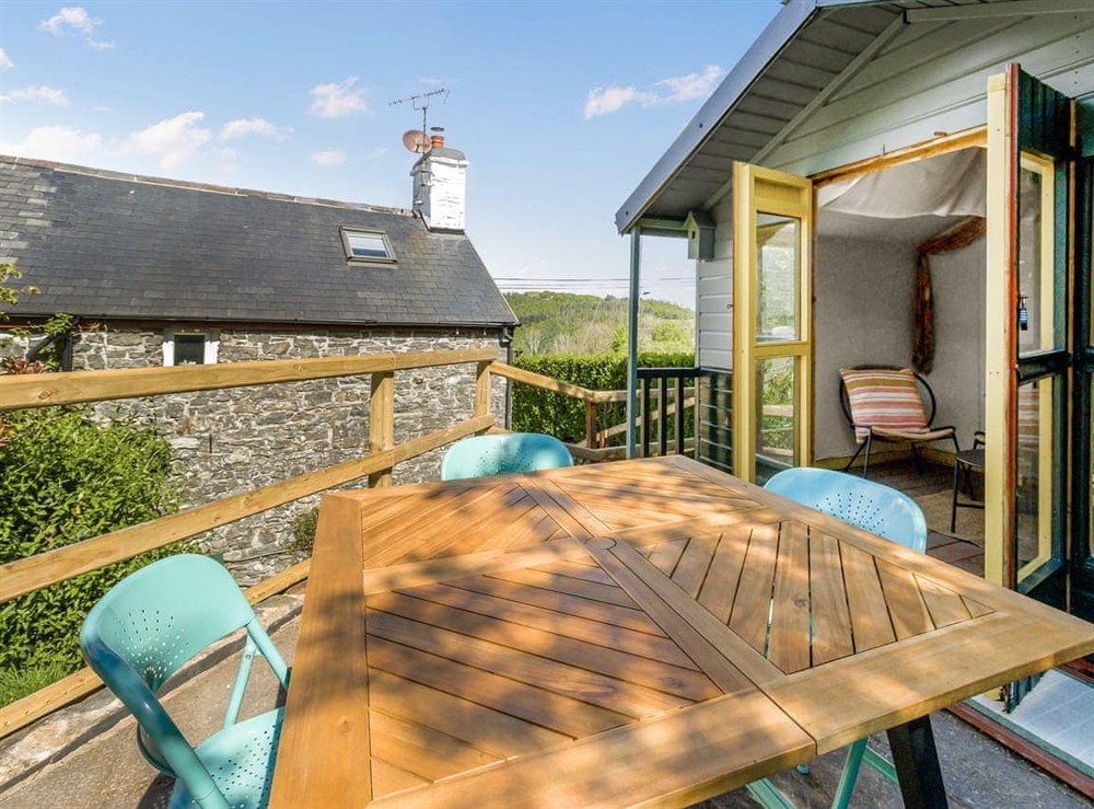 Outdoor eating area at 3 Legged Duck Cottage in Ystrad Muerig, Dyfed
