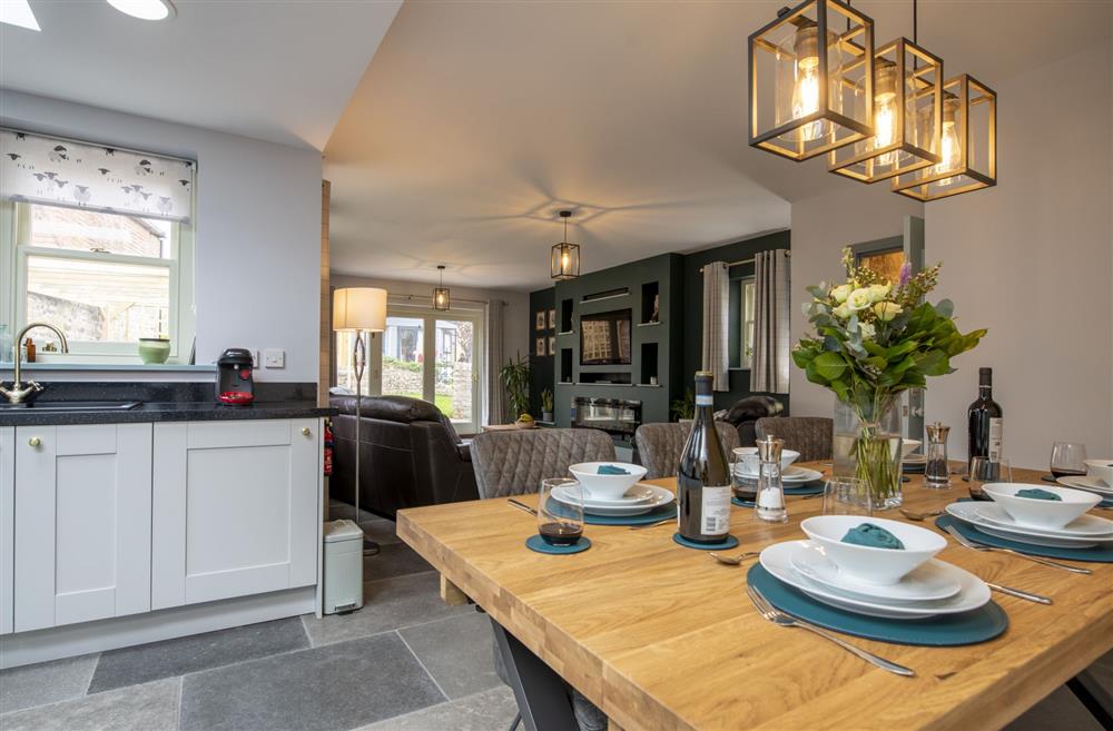 Open-plan dining, kitchen and sitting area at 3 Mill Cottages, Richmond