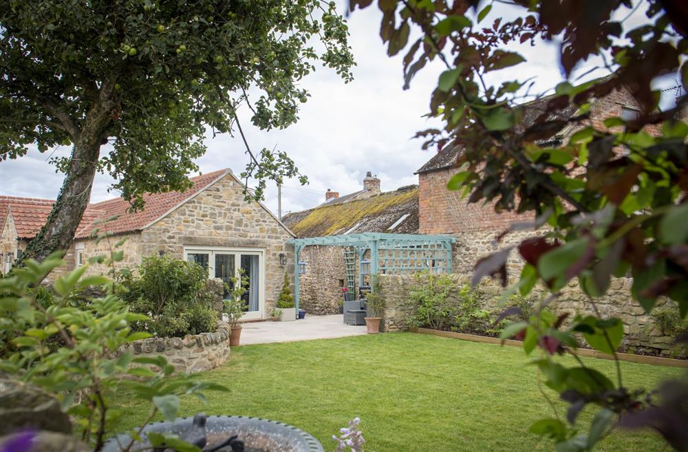 The cottage garden at 3 Mill Cottages, Yorkshire is the perfect place to enjoy with family and friends