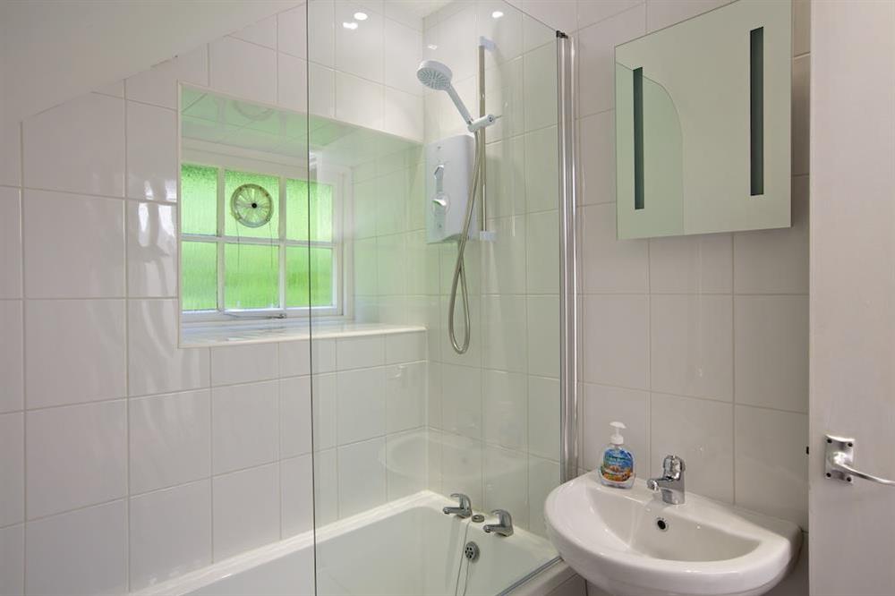 Family bathroom with shower over bath at 3 Moult Farm Cottage in , Salcombe