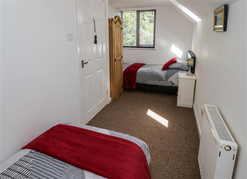 A bedroom in 3 Oaks Lodge at 3 Oaks Lodge, Pulverbatch near Pontesbury