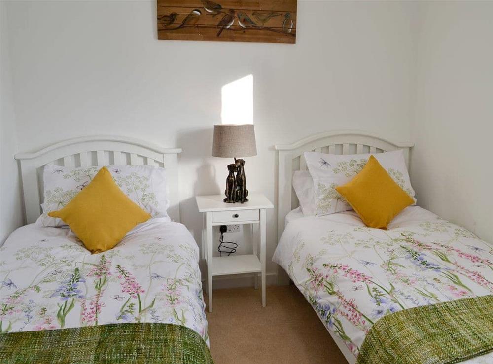 Pretty twin bedded room at 3 Old Posting Stables in Gatehouse of Fleet, near Kirkcudbright, Kirkcudbrightshire