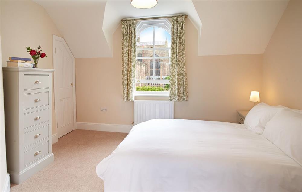 Second floor:  Bedroom with 5’ king-size bed and cathedral view at 3 Palace Yard, Hereford