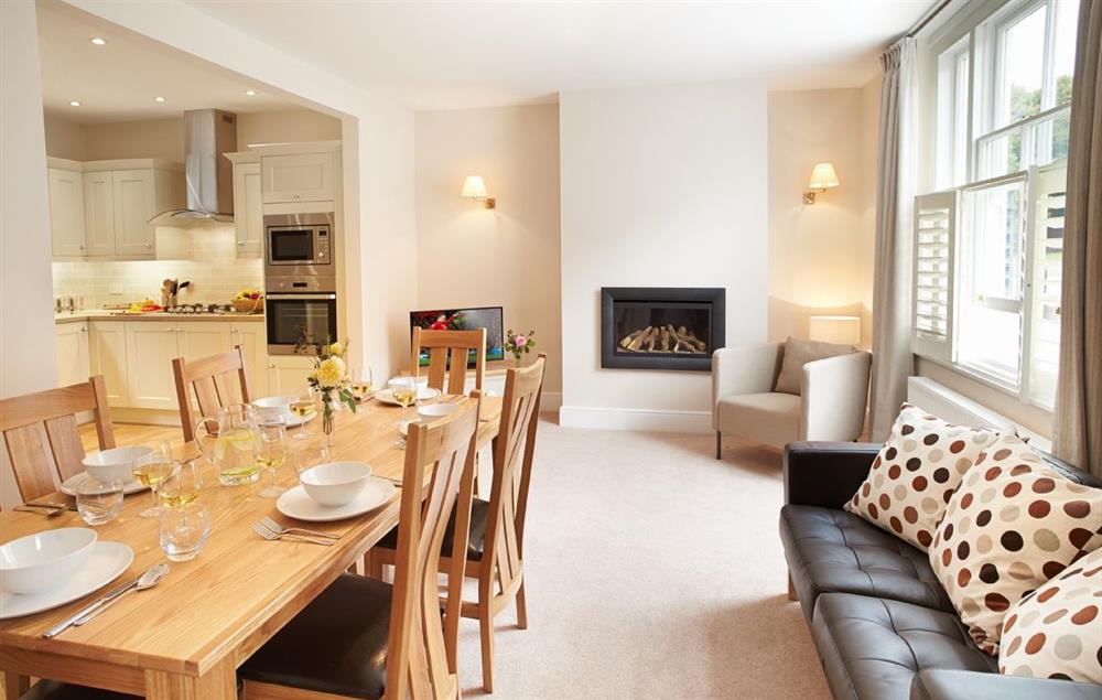Spacious open-plan living area with contemporary flame effect fire and cathedral view at 3 Palace Yard, Hereford