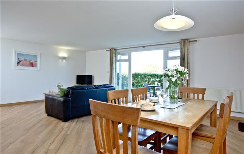 Living room and dining area at 3 Red Rock Apartments, Dawlish Warren, Devon