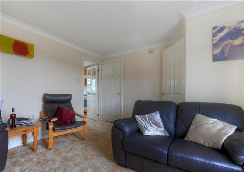 Relax in the living area at 3 Riverside Cottages, Charmouth