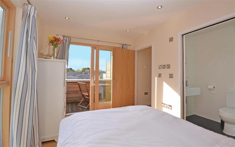 Another view of the master bedroom showing the private balcony at 3 Talland in Talland Bay