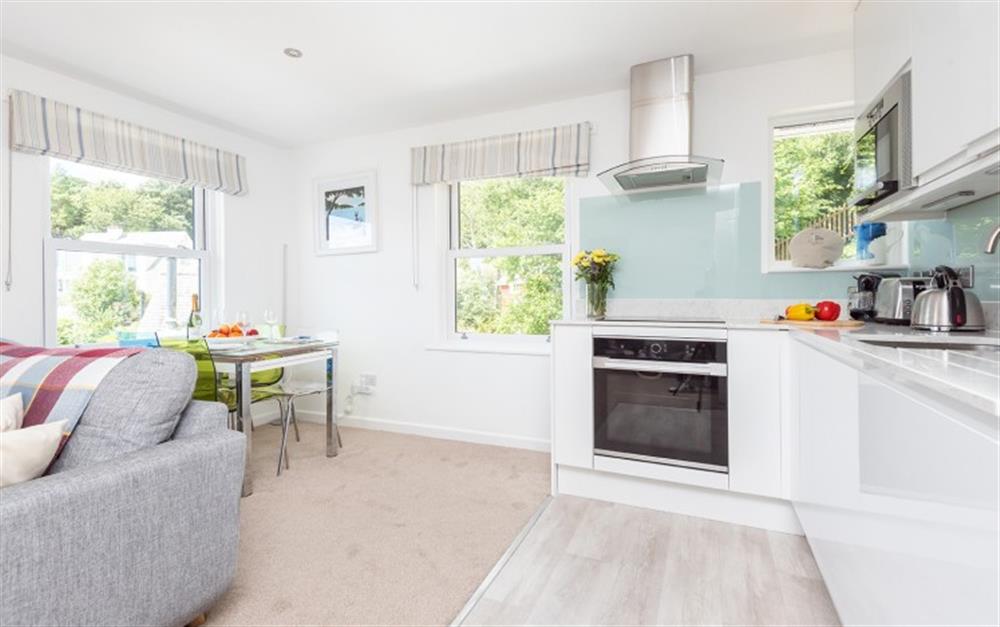 Dual aspect windows make this living and dining area a bright and airy space. at 3 The Boat House in Helford Passage