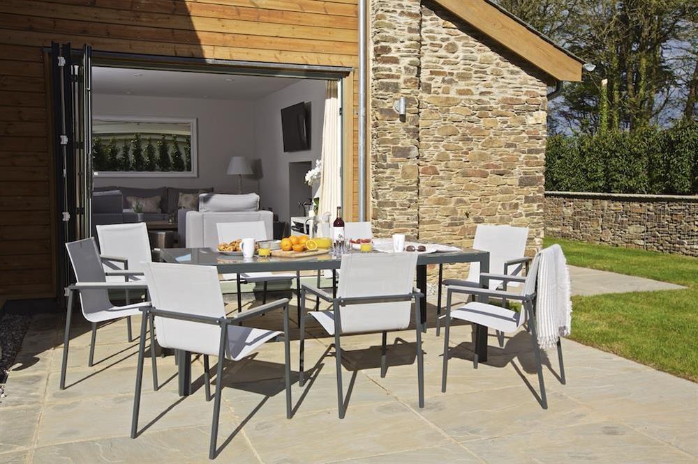 Good-sized stone terrace - furnished with a garden table and eight chairs (photo 2) at 3 The Drive in , Hillfield, Dartmouth