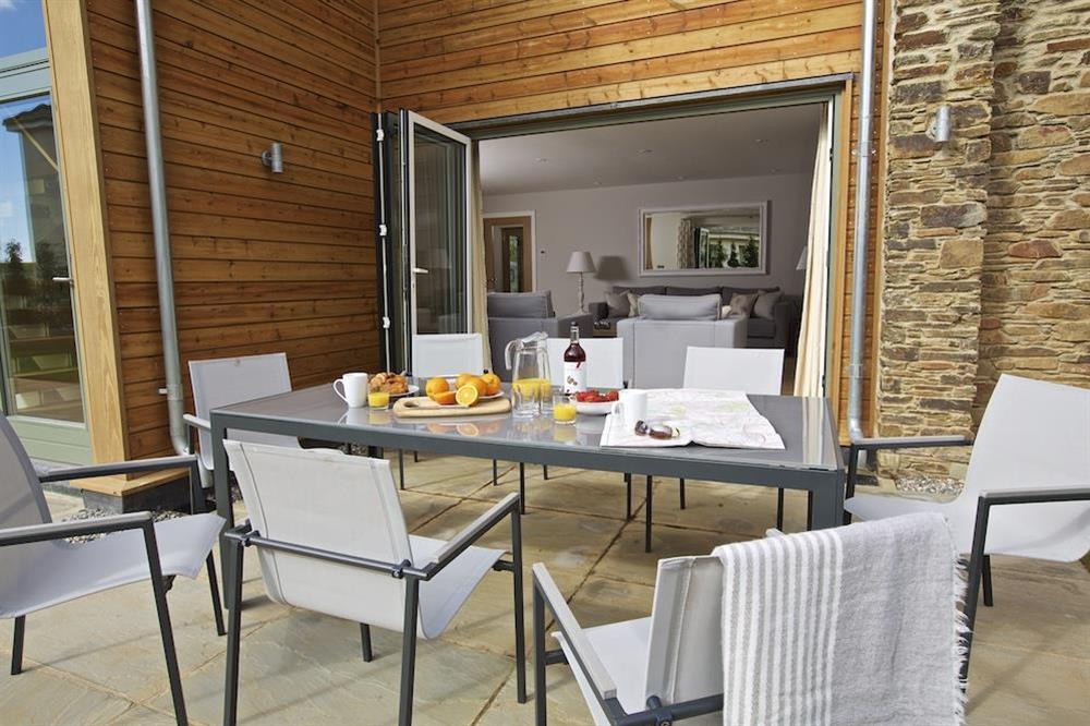Good-sized stone terrace - furnished with a garden table and eight chairs (photo 3) at 3 The Drive in , Hillfield, Dartmouth