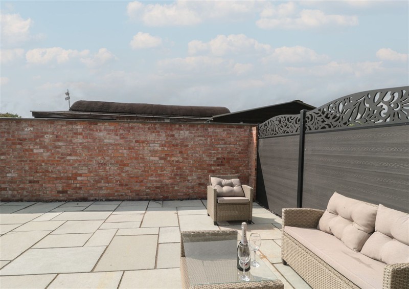 Enjoy a cup of tea on the patio at 3 The Stables, Watchfield near Highbridge
